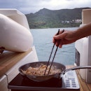 Stir-frying squid on the yacht while we wait for fish to bite the baits!