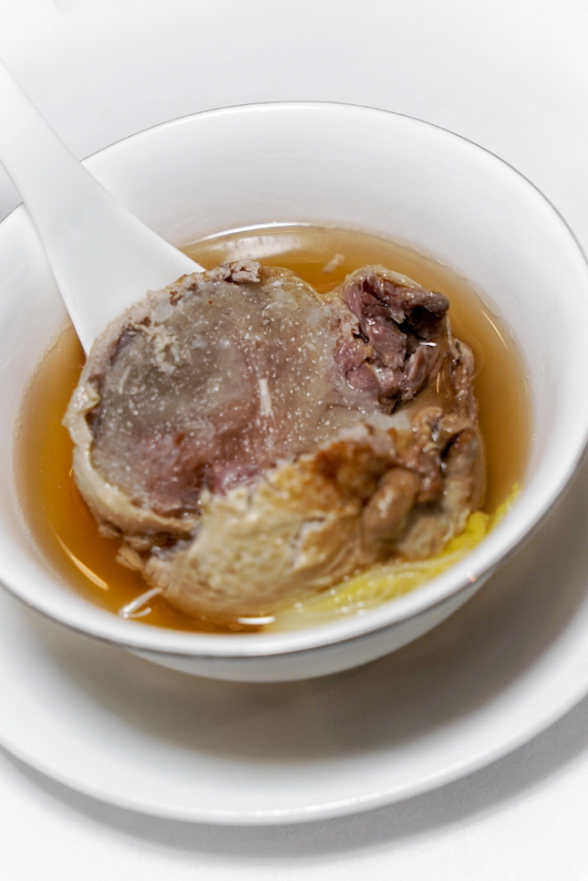 Boneless quail filled with bird’s nest in supreme broth