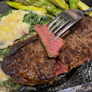 NZ Striploin 250g Steakhouse chargrilled medium rare with parmesan asparagus and cream parmesan spinach.