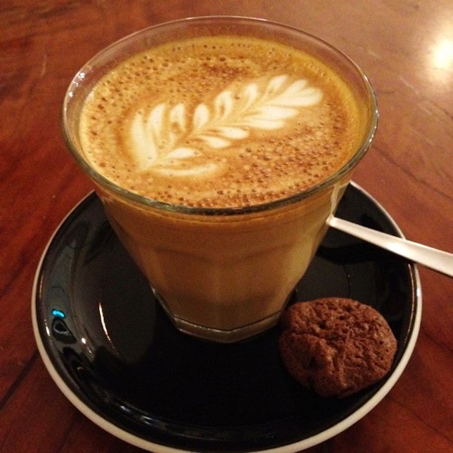 Flat white with a chocolate cookie