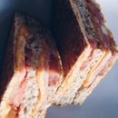 Triple decker sandwich snack -ham, cheese, tomato and whole meal bread.