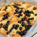 Baked French Toast croissant style with blueberries.