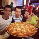 A #pizza as big as three heads combined...
