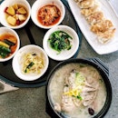 Homemade Korean ginseng chicken soup, gyoza, banchan.