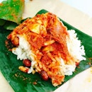 Nasi Lemak bungkus - standard breakfast size serving of fragrant coconut rice, sambal, roast peanuts, fried anchovies and a sliver of egg - RM1.50 (389cals/packet)  #yumyumyap #myfood #calories #mamak #appuunclecurryhouse #burpple