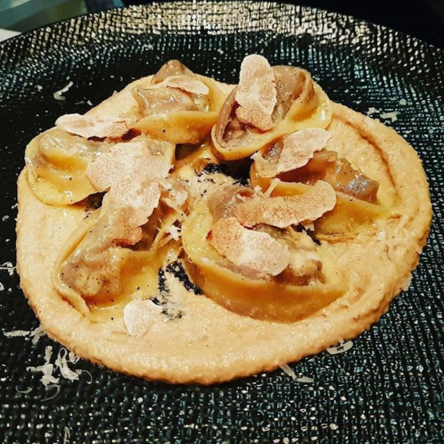 White truffle bone marrow “agnolotti” served with walnut pesto..