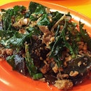 Century eggs get a Thai makeover with basil leaves and minced pork.