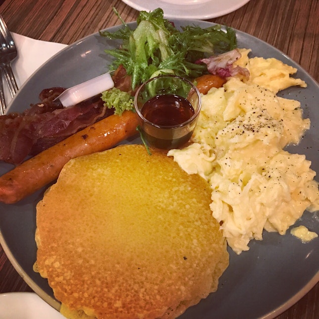 Pancakes With Scrambled Eggs, Bacon And Sausage