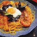 Tomato-based spaghetti with yuba, bacon, shrimp, mozzarella and onsen egg - a strangely very delicious combination mhmm #latergram