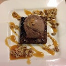 Sweet and Salty Brownie topped with caramel sauce and crunchy toasted walnuts.