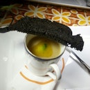 Spicy broccoli cream with saute rock lobster & fried charcoal bread