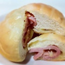Japanese styled chewy bread with ham and oozing cheese