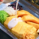 3 kinds of sticky rice, some rice krispies, a dollop of that coconut cream and an entire whole mango that's super sweet at just 130 THB.