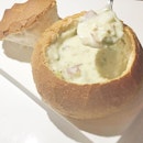 New England Clam Chowder ($12.90/ bread bowl) Chopped Ocean Clams, Potatoes, Celery, Onion, Thyme, White Pepper, Sea Salt, Clam Stock, Half-and-Half, Butter, Flour  Be prepared to wait about 15 minutes for the order.