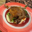 Popular Duck Confit made with Baby Carrots, Potatoes, Pomegranates & Red Wine.  Book a table now at http://bit.ly/2XU64GE
