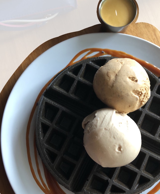 Charcoal Waffle with Two Scoops of Ice Cream and Salted Egg Yolk sauce
