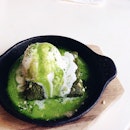 Green tea brownie with vanilla ice cream and then pour in the green tea sauce over sizzling pan.