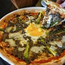 La Nonna.
Thin crust pizza from wood fire oven, with a tomato based, topped with generous amount of truffle paste, and ooze egg as a center of the pizza.