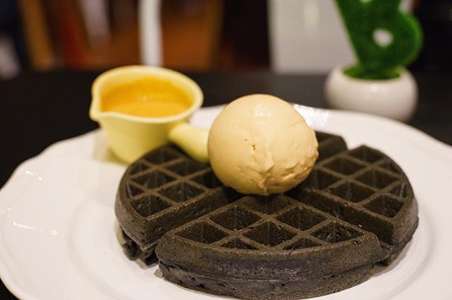 Charcoal Waffle with Homemade Salted Egg Yolk Sauce and Thai Red Tea Ice Cream