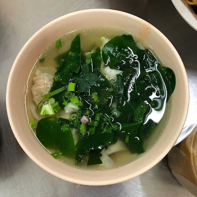 Dumpling soup with loads of greens.