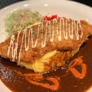Huge fried fish fillet with omelette rice with level 2 Japanese curry.