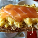 Salmon-on-top-of-scrambled-egg-on-top-of-duck-rilette-on-top-of-crispy-toast