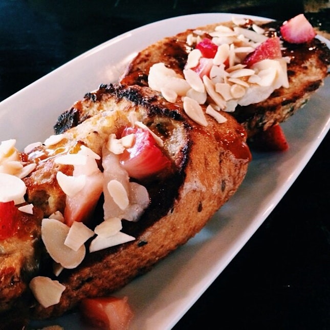 French toast with caramel, strawberries, almonds and lychees. 