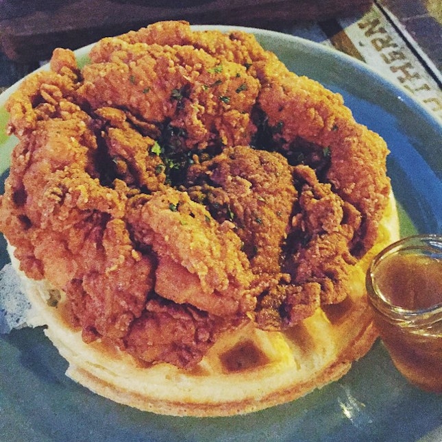Look at this mean mean deep fried juicy chicken thigh and buttermilk waffle with bourbon maple syrup!