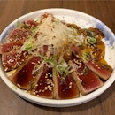Ahi tuna tataki - Yellowfin tuna with onion silvers & Wasabi yuzu vinaigrette [$18.80]