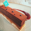 Trianon ($10.37) 
Is a hazelnut biscuit base with chocolate cream.
