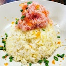 Crabmeat fried rice  The pink and fluffy candied crabmeat floss with salmon roe on top of the fried rice makes the dish more appealing both aesthetically and flavour wise.