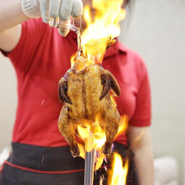 🔥🍗 Flame Gong Fu Chicken $18+The roast chicken is brought up to customers in a vertical position.