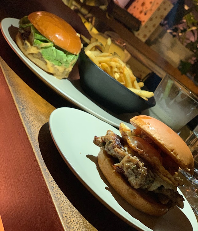 Signature Basic Burger In The Background And Chicken Burger At The Front