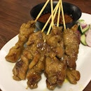 Flavourful and juicy chicken satay skewers.