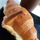 My ham & cheese croissant with kao coffee..
