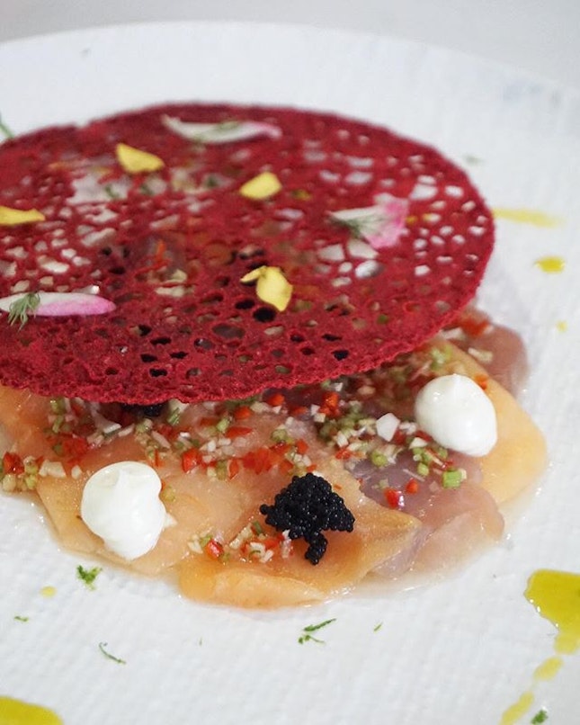 Carpaccio ($18) – stunning red coral tullie revealing a bed of braised daikon radish, fish slices, lime mayo and black fish roe with citrus Asian dressing and herb oil, drizzled with lime zest.
