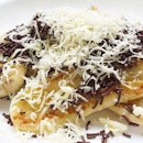 Grilled banana with chocolate and cheese.