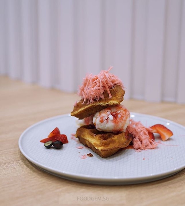 This pretty dessert comes with crispy waffles with honey citron ice cream, strawberry, blueberries and topped with a cloud of magical pink fairy floss.