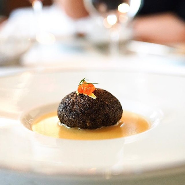 Lobster mousse encased in black truffle, served with classic fish bone sauce.