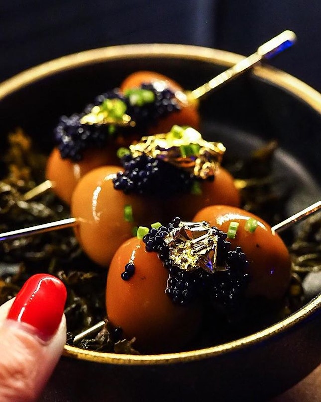 My quail eggs are better than yours <Tea Cooked Quail Eggs S$12> Tea infused quail eggs + caviar + golden stuff on a bed of delish sautéed tea leaves @life_as_eliza 🤤 This is good ♥️ #appetizergoals .