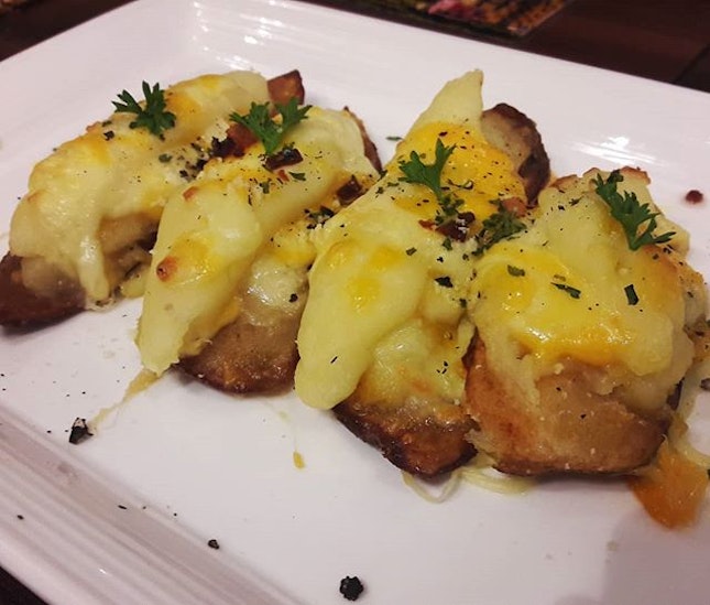 Really really really cheesy potato skins, the cheese pull strings are real for this one!