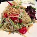 Som Dtum Malakor - Pounded green papaya #salad, cherry tomatoes, chili, dried shrimp with a sweet & sour tamarind dressing with a side of candied pork.