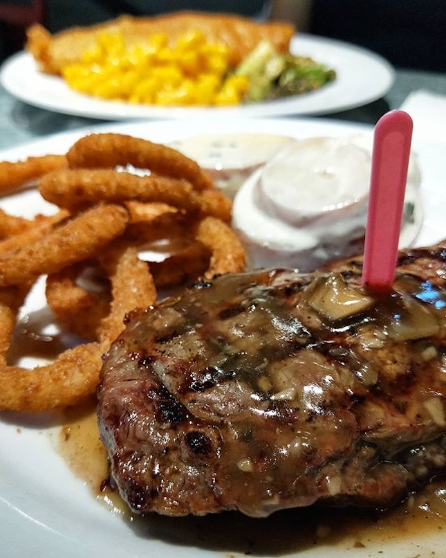 NZ Striploin 200g ($18 nett) | Medium  rare steak drizzled with mushroom sauce, paired with onion rings and potato salad!