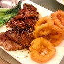Spare Ribs (SGD $16.00) served with vegetables and Onion Rings on the side.
