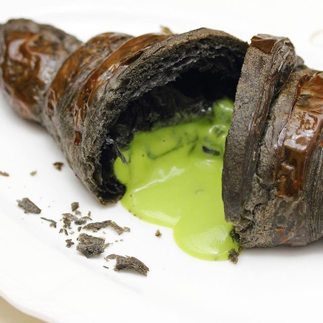 [Antoinette] - Inspired by the traditional breakfast of kaya and toast, Chef Pang created the charcoal infused croissant.