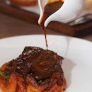 [The Disgruntled Chef] - The Braised Veal Cheeks ($34) is served on top of a yorkshire pudding and wilted spinach.