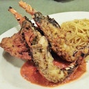 Oven baked lobster and deep fried chicken on a bed of spaghetti with garlicky cream sauce..